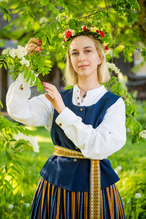 Latvian woman in traditional clothing. Ligo folk.の写真素材