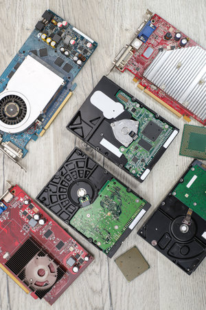 Disassembled hard drive on a wooden background. Close-up.