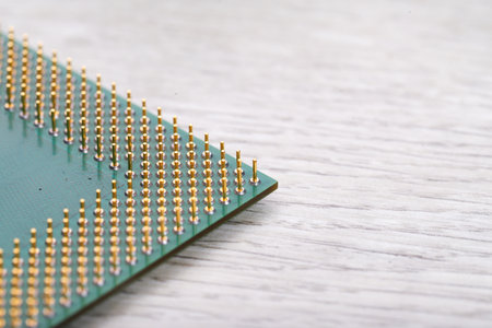 Electronic chip on white wooden background. Close-up. Selective focus.