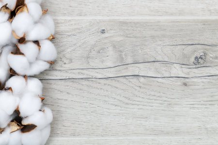 Fluffy cotton ball on wooden background, top view, copy spaceの写真素材