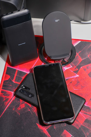 Smartphone with wireless charger, reverse charging from phone to phone, wireless power transportation technology conceptの写真素材