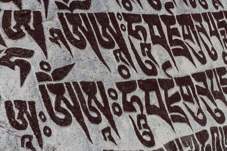 Buddhist prayer symbols on stone on the way to Everest base camp, Nepal