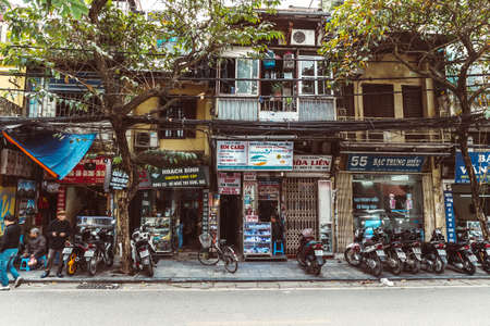 HANOI, VIETNAM - DECEMBER 14, 2018 : Street scene of the Old Quarter of Hanoi during the day. Lots...