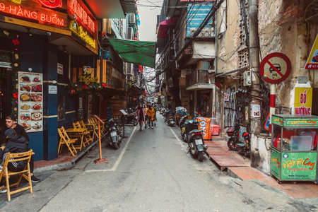 HANOI, VIETNAM - DECEMBER 14, 2018 : Street scene of the Old Quarter of Hanoi during the day. Lots of people and traffic in the narrow street.のeditorial素材