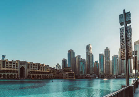 DUBAI, UAE - DECEMBER 12, 2018: View at Burj Khalifa Lake and Modern buildings in Dubai Downtown,...