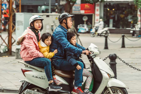 HANOI, VIETNAM - DECEMBER 15, 2018 : Street scene of the Old Quarter of Hanoi during the day. Lots of people and traffic in the narrow street.のeditorial素材