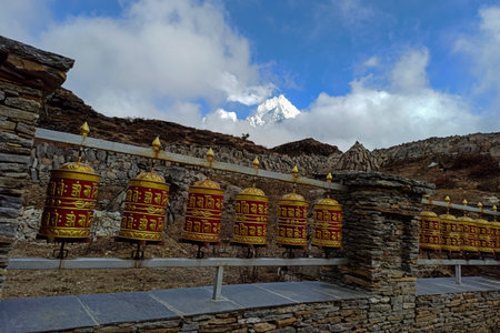 Prayer drums are part of the Buddhist culture. Prayer drums are rotated by hands.