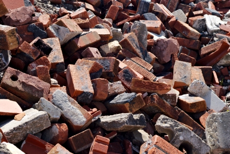 Messy pile of jagged red bricks and debris の写真素材