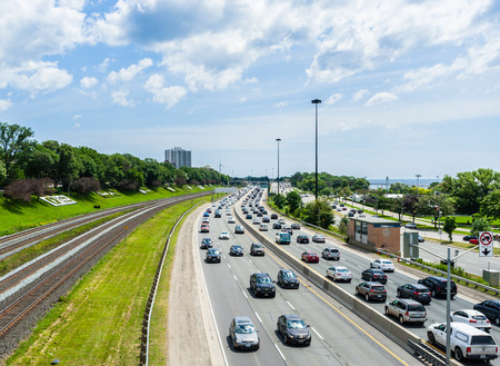 TORONTO, CANADA - JULY 29, 2017: Weekend traffic builds on the Gardiner Expressway, the main highway...