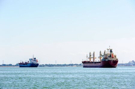 HAMILTON, CANADA - SEPTEMBER 23, 2018: Two cargo ships are at anchor in Hamilton Harbour.のeditorial素材