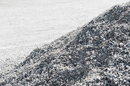 Pile of gray gravel rocks sloping diagonally.