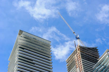 TORONTO, CANADA - MARCH 17, 2019: Construction of modern residential condominium towers nears completion in Etobicoke, in the west end of the city.のeditorial素材