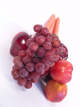 A bunch of fruit and vegetable, including, carrot, apple, apricot and grapesの写真素材