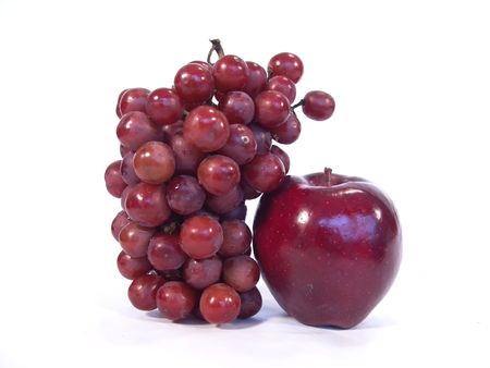 Apple and a bunch of grapes close up viewの写真素材