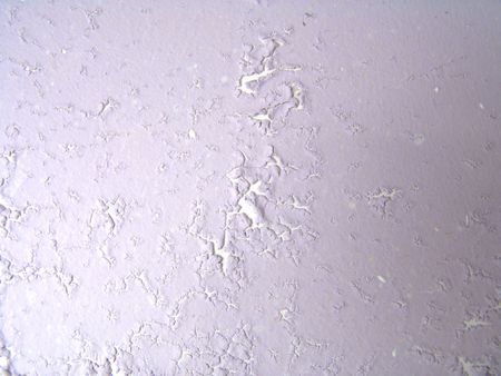 Macro view of old paint damaged by moistureの写真素材