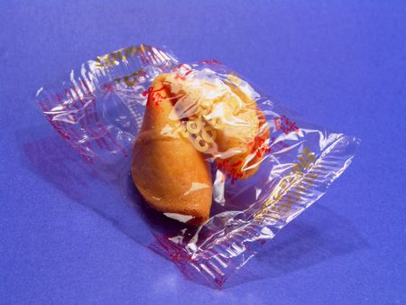 Fortune cookie in its plastic package (with Chinese words)の写真素材