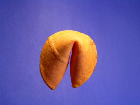 A single fortune cookie isolated and suspending in the airの写真素材