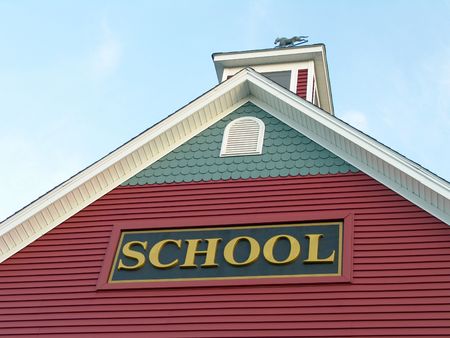 Colonial House School Building Against Blue Sky                               