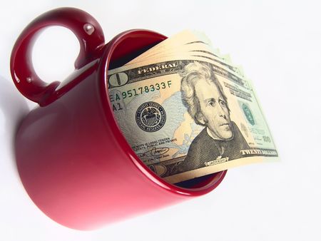Isolated mug with 20 dollars US bills insideの写真素材