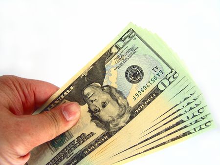 Hand holding US Twenty Dollar Billsの写真素材