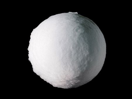 A perfectly round and large snowball ice globe isolated on black background                            の写真素材