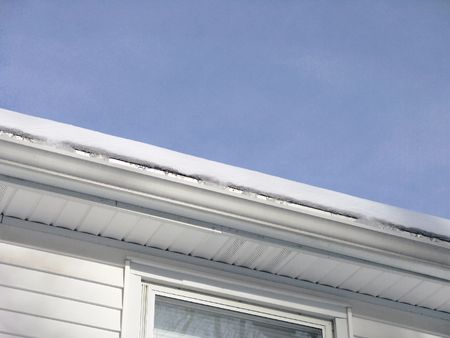 Snow accumulation on a roof close-up (6 inches thick)                               の写真素材