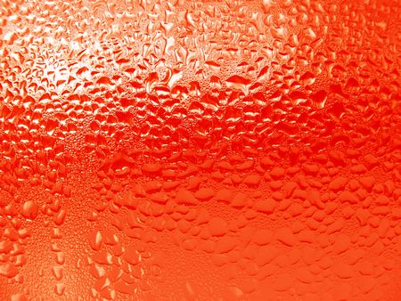 Close-up clear drops of water on window glass surface                               の写真素材