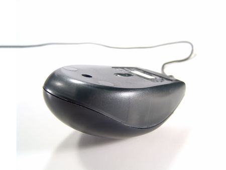 Flipped over computer mouse with cable (Isolated on white background)                               の写真素材