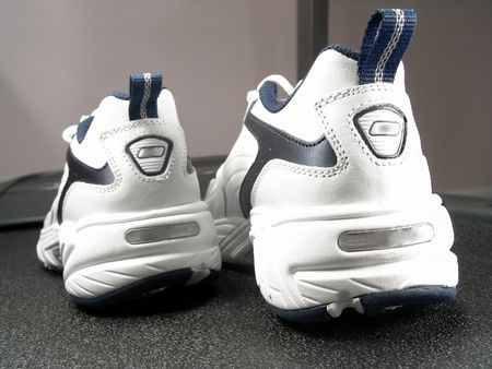 Closeup view of brand new sport shoes on a treadmill                               の写真素材