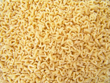 Close-up pattern background of alphabet noodle showing numbers and alphabets                               の写真素材