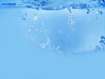 Close-up of water waving and splashing caused by dropping objects                               の写真素材