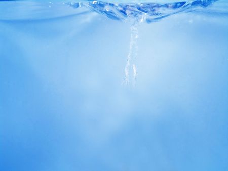 Close-up of water waving and splashing caused by dropping objects                               の写真素材