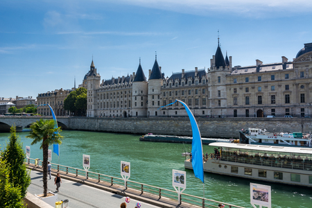 Paris, France - August 13, 2016: The conciergerie and the river Seine. The Conciergerie is a building in Paris, formerly a prison but presently used mostly for law courts.のeditorial素材