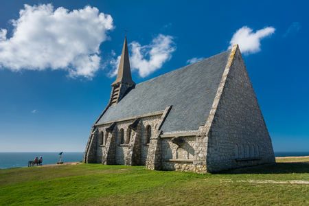 Etretat, France - September 8, 2016: Etretat is best known for its chalk cliffs, including three natural arches and a pointed formation called L'Aiguille or the Needle, which rises 70 metres above the sea.のeditorial素材