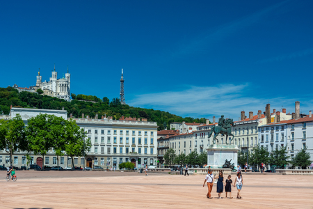 Lyon, France - July 18, 2018: The Bellecour square in Lyon with Statue of Louis XIV and basilica of our lady of Fourviere. This is the central square of the city of Lyon.のeditorial素材