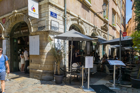 Lyon, France - July 19, 2018: Tourists eating ice cream at Terre Adelice, one of the best ice cream shop in Lyon, Located in the Old Lyon districtのeditorial素材