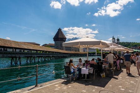 Lucerne, Switzerland - May 31, 2019 : The Kapellbrucke (Chapel Bridge) is a covered wooden footbridge spanning the River Reuss diagonally in the city of Lucerne.のeditorial素材