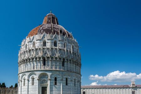 Pisa, Italy - June 6, 2019 : The Pisa Baptistery of St. John is a Roman Catholic ecclesiastical building. The baptistery was designed by Diotisalvi, whose signature can be read on two pillars inside the building, with the date 1153.の写真素材