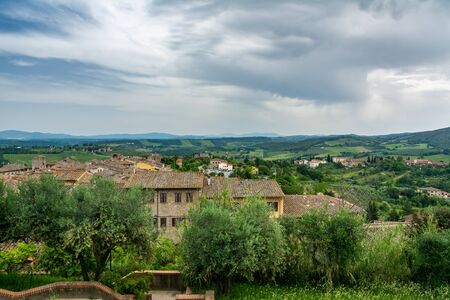 San Gimignano is a small walled medieval hill town. It is famous for its medieval architecture, unique in the preservation of about a dozen of its tower houses.の写真素材