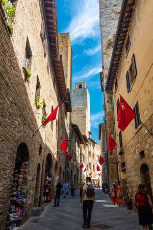 San Gimignano, Italy - June 7, 2019 : San Gimignano is a small walled medieval hill town. It is famous for its medieval architecture, unique in the preservation of about a dozen of its tower houses.のeditorial素材