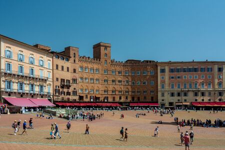 Siena, Italy - June 7, 2019 : Piazza del Campo is the principal public space of the historic and is regarded as one of Europe s greatest medieval squares.のeditorial素材
