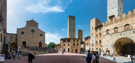 San Gimignano, Italy - June 7, 2019 : San Gimignano is a small walled medieval hill town. It is famous for its medieval architecture, unique in the preservation of about a dozen of its tower houses.のeditorial素材