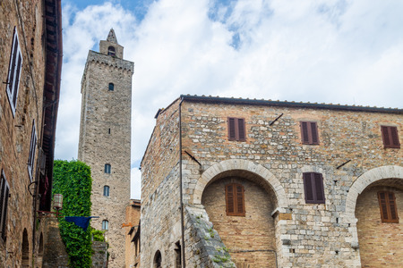San Gimignano, Italy - June 7, 2019 : San Gimignano is a small walled medieval hill town. It is famous for its medieval architecture, unique in the preservation of about a dozen of its tower houses.のeditorial素材