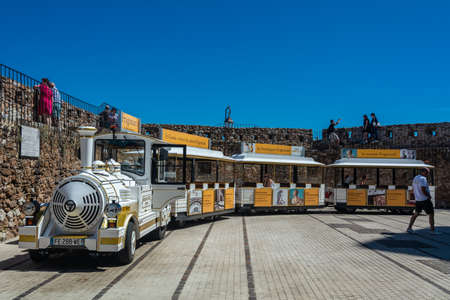 Cannes, France - June 12, 2019 : A touristic train on a picturesque observation deck near Castre castle in Cannes (Le Suquet)のeditorial素材