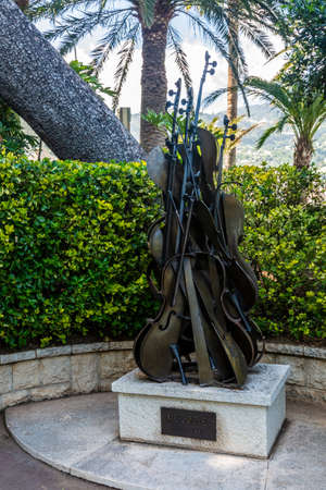 Monte Carlo, Monaco - June 13, 2019 : A statue named Melodie - Melody made by Arman 1984 - in the garden of Saint-Martin on the rock of Monaco.のeditorial素材