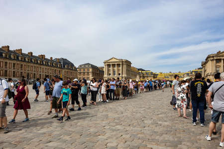 Versailles, France - August 27, 2019 : People visiting the Palace of Versailles, a royal chateau in Versailles, France. Marble Court. It was added to the UNESCO World Heritage List.のeditorial素材