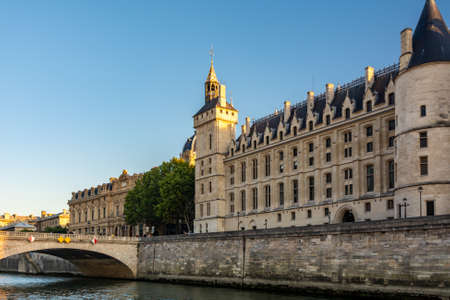 Paris, France - August 29, 2019: Bridge of Change and Conciergerie Castle over river Seine, a former prison, located on west of the Cite Island and today is a part of Palais de Justice.のeditorial素材