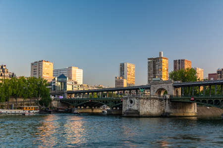 Paris, France - August 29, 2019: People walking on Bir Hakeim bridge, with high buildings in the background, Paris Franceのeditorial素材