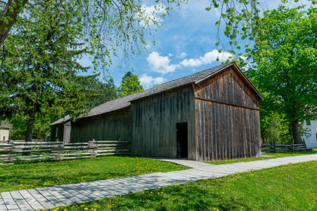 Toronto, ON, Canada â May 15, 2022: View the over forty 19th-century buildings in the open-air heritage museum Black Creek Pioneer Village in Toronto, Ontario, Canada. The village is a recreation of life in 19th-century Ontario and gives an idea of how のeditorial素材