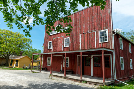 Toronto, ON, Canada â May 15, 2022: View the over forty 19th-century buildings in the open-air heritage museum Black Creek Pioneer Village in Toronto, Ontario, Canada. The village is a recreation of life in 19th-century Ontario and gives an idea of how のeditorial素材